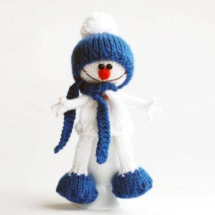 Lovely And Sweet Snowman In The Blue Hat And Scarf..
