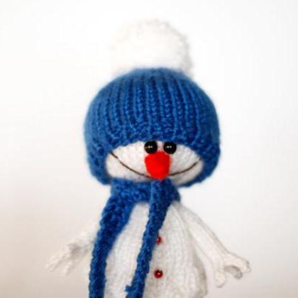 Lovely And Sweet Snowman In The Blue Hat And Scarf..